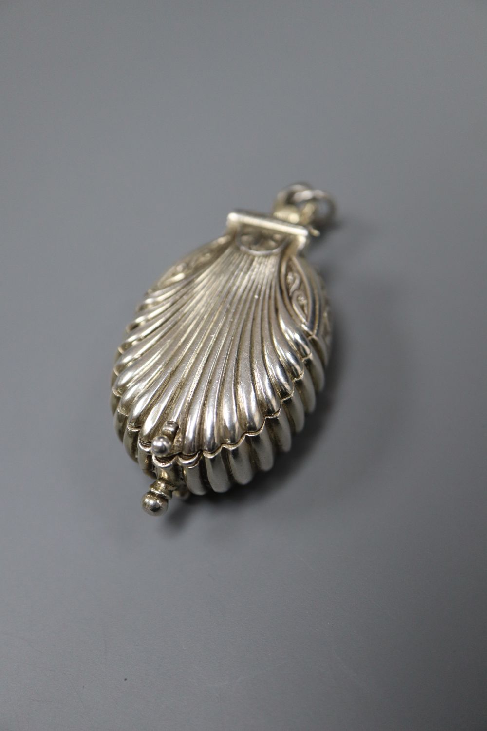 A modern limited edition St. Jamess House Company parcel gilt silver pendant watch, of shell form,